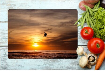 luxury printed cutting board made of glass with a photo of the setting sun at sea -  28x39 cm